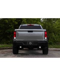 Chevrolet Colorado parked outside with trees in the background with additional SSC2 led pods lit up for reverse lights